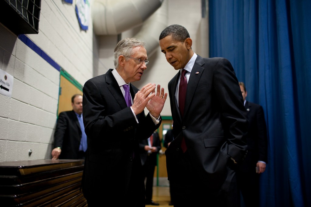 President Barack Obama talks with Senator Harry Reid (D-Nev.)